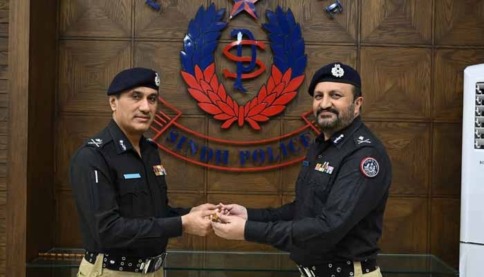 Karachi Additional Inspector General of Police Jawed Akhtar Odho (right) takes charge of Sindh Inspector General of Police from outgoing IGP Ghulam Nabi Memon, Central Police Office, Karachi, December 31, 2025. — X@SindhPoliceDMC