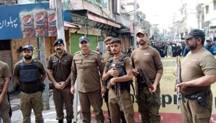 Punjab police personnel standing guard on the road on August 26, 2024. — Facebook@PunjabPolicePakistanOfficial
