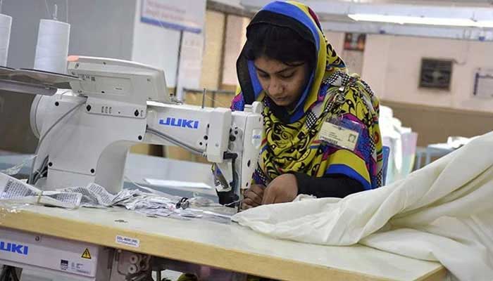 Representational image shows a female worker working at a textile factory in Faisalabad.— AFP/File