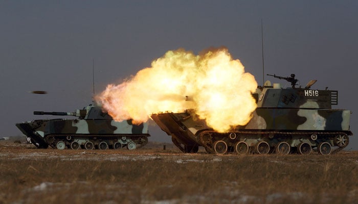 A tank of the Peoples Liberation Army Navy Marine Corps fires during a military drill at a base in China’s Jilin province in 2015. — Reuters