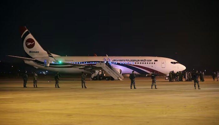 Security personnel stand guard outside of the hijacked aircraft of the Biman Bangladesh Airlines in the Shah Amanat International Airport in Chittagong, Bangladesh, February 24, 2019. — Reuters