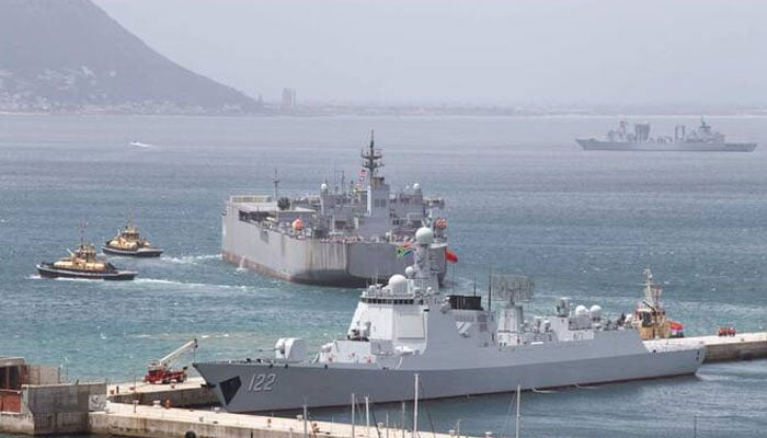 A Chinese guided-missile destroyer and an Iranian navy ship in the Simons Town harbor, near Cape Town, on Thursday. —AFP