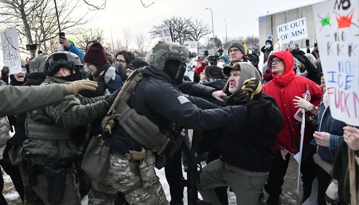 Protestors clash with federal agents outside the Bishop Henry Whipple Federal Building in Saint Paul, Minnesota, on January 8, 2026. — AFP