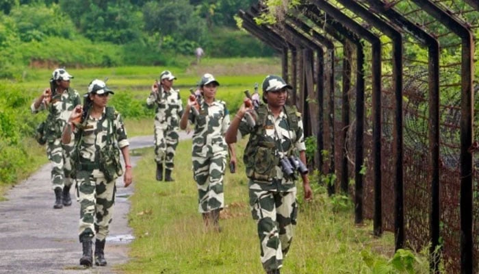 Indias Border Security Force personnel patrol along the fencing of the India-Bangladesh international border. — Reuters/File