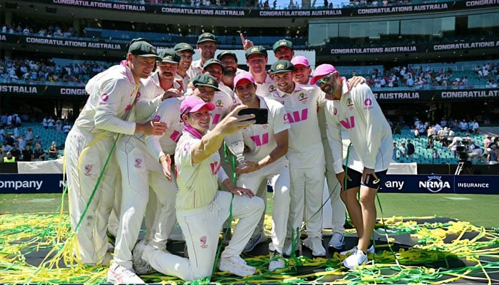 Australian players pose for a selfie by skipper Steve Smith. —AFP