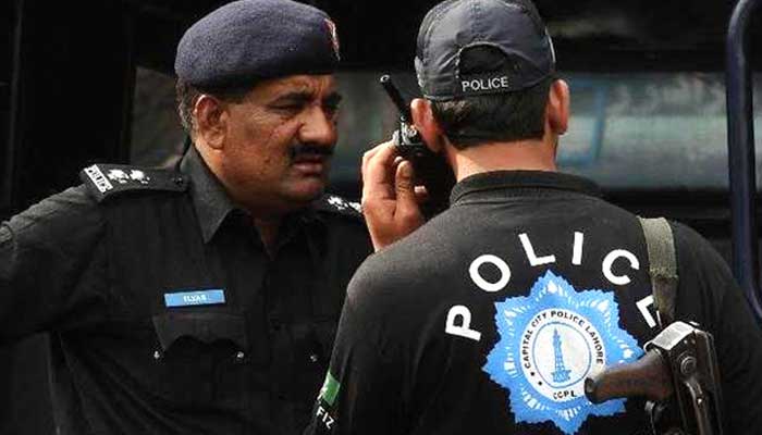 Police officials communicate during a law-and-order deployment. — AFP/File