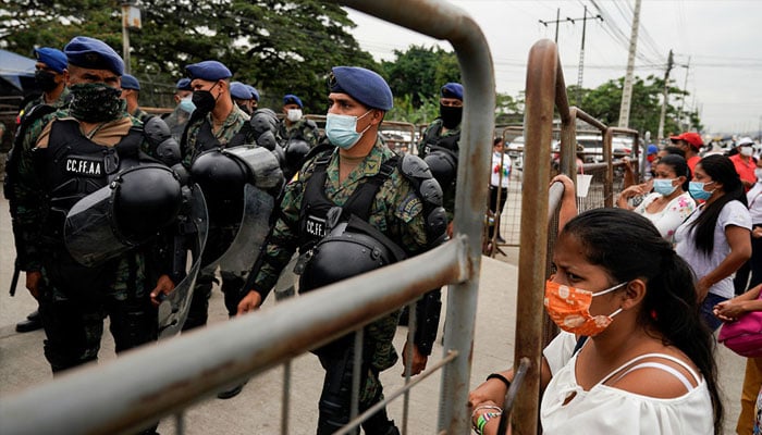 Soldiers stand guard outside the Penitenciaria del Litoral prison where prisoners were killed and injured during a riot, in Guayaquil, Ecuador November 15, 2021.—Reuters