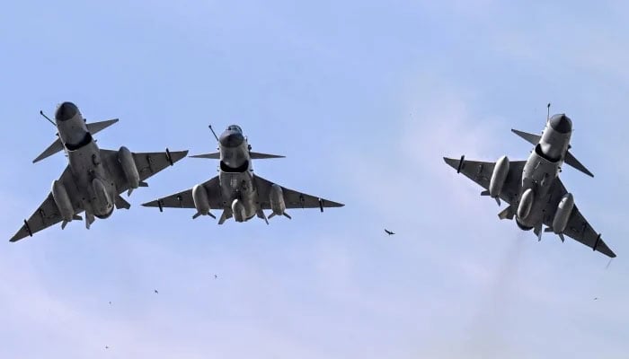 Pakistan Air Force J-10 fighter jets fly past during the national day parade in Islamabad on March 23, 2025. — AFP