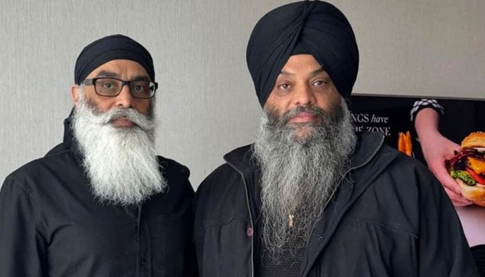 Khalistani Sikh activist Paramjeet Singh Pamma (right) poses with fellow activist. — Reporter/Saeed Niazi/File