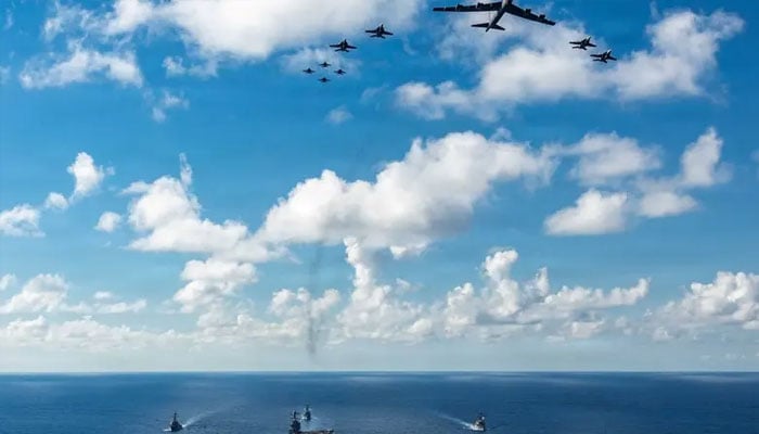 The US Navy’s Gerald R Ford Carrier Strike Group, including the flagship USS Gerald R. Ford, USS Winston S Churchill, USS Mahan and USS Bainbridge, sail towards the Caribbean Sea under F/A-18E/F Super Hornets and a U.S. Air Force B-52 Stratofortress, in the Atlantic Ocean November 13, 2025. —Reuters