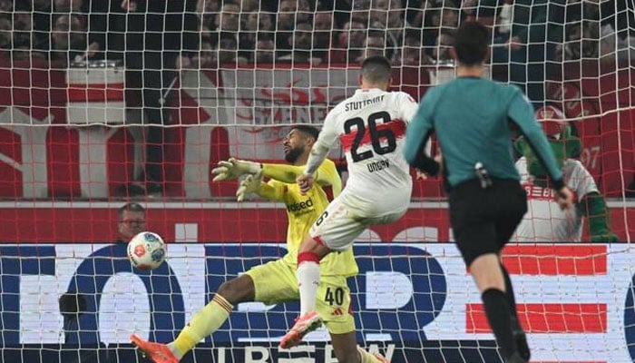 Frankfurt’s Brazilian goalkeeper Kaua Santos saves the ball against Stuttgart’s German forward Deniz Undav during their Bundesliga match in Stuttgart, southern Germany, on Jan. 13, 2026. —AFP