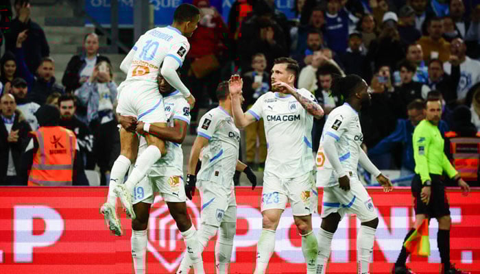 French giants Marseille team players celebrating. — AFP/File