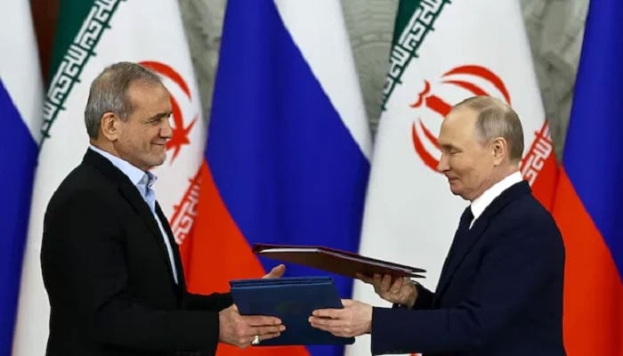 Russian President Vladimir Putin and Iranian President Masoud Pezeshkian attend a document signing ceremony in Moscow, Russia, January 17, 2025. — Reuters