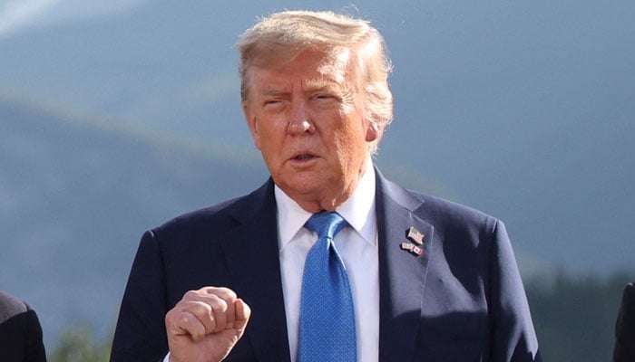 U.S. President Donald Trump gestures as he attends a family photo session during the G7 Summit, in Kananaskis, Alberta, Canada, June 16, 2025. — Reuters