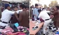 Viral video shows traffic cop being assaulted by encroachers in Saddar