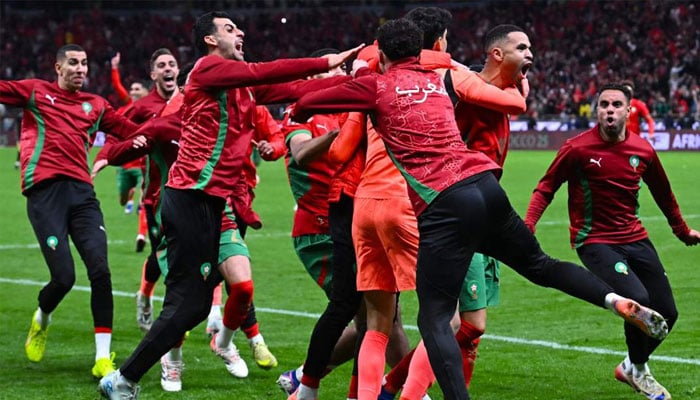 Moroccos players celebrate after winning the Africa Cup of Nations semi-final against Nigeria in Rabat on 14 January 2026.—AFP