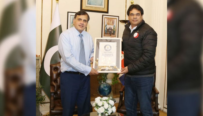 Pakistani senior tennis player Talha Waheed (right) is seen with  Pakistan’s High Commissioner to the United Kingdom, Dr Mohammad Faisal. — Reporter