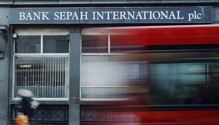 A red London bus passes a branch of Iranian owned Bank Sepah International in London December 22, 2011. — Reuters
