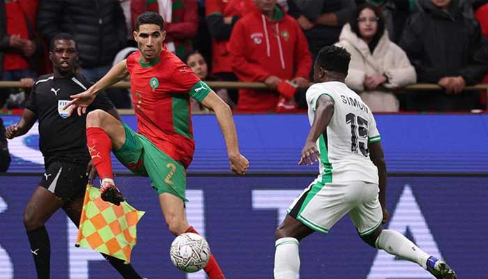 Moroccos defender #02 Achraf Hakimi controls the ball in front of Nigerias forward #15 Moses Simon during the Africa Cup of Nations (CAN) semi-final football match between Nigeria and Morocco at the Prince Moulay Abdellah stadium in Rabat. — AFP/File