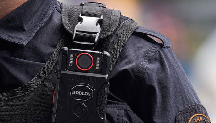 A police officer with bodycam shoulder. —boblov.com/File