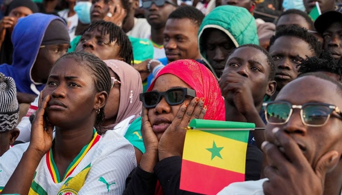 Fans gather to watch a broadcast of the Africa Cup of Nations semifinal match between Egypt and Senegal, in Dakar, Senegal. —AFP