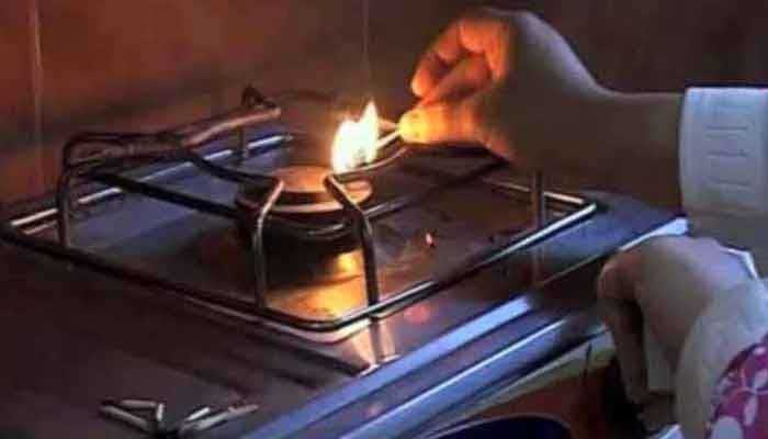 A woman is seen lighting the gas stove. — The News/File