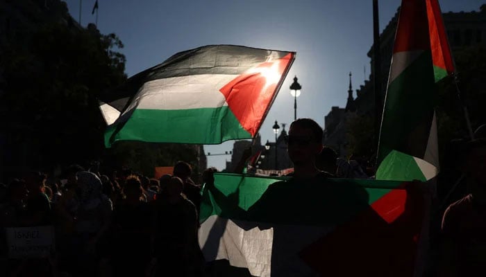 Pro Palestine protesters record their protest in Madrid, Spain on September 14, 2025. — Reuters