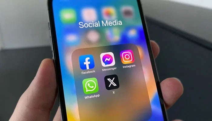 A representational image showing the icons of different social media platforms displayed on a phone screen. — Unsplash/File