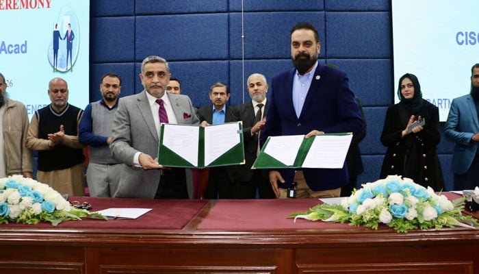 MOU exchanges after signing an agreement between AIOU and Cisco NetAcad during a ceremony on January 22, 2026. — Facebook@AIOU.OfficialAccount