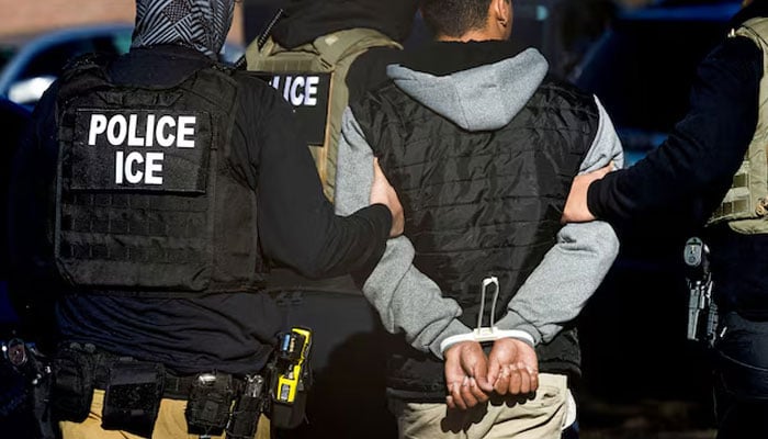 Immigration and Customs Enforcement agents detain a man after conducting a raid at the Cedar Run apartment complex in Denver, Colorado, US, February 5, 2025. — Reuters