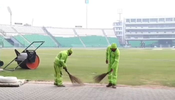 Lahore Waste Management Company (LWMC) workers are cleaning the Gaddafi Stadium on January 28, 2026. — Screengrab via Facebook@LWMC1139