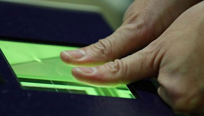 Representational image of a person placing both thumbs on the biometric machine. —TheNews/File