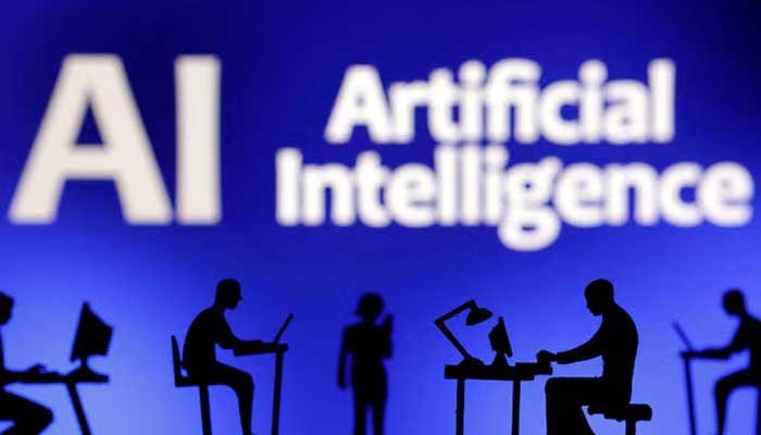 Figurines with computers and smartphones are seen in front of the words Artificial Intelligence AI in this illustration taken, February 19, 2024. — Reuters