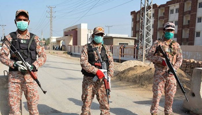 Ranger personnel standing guard on the road. — Radio Pakistan/File