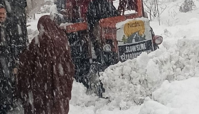 A snow-heaped road is being cleared in Shangla on January 23, 2026.  — Facebook@dcoswat