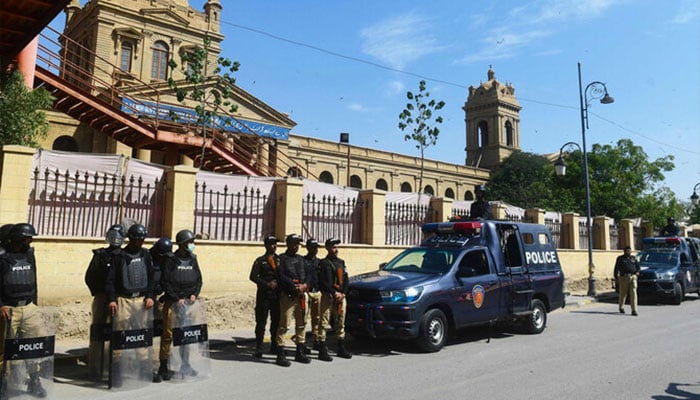 Policemen stand guard in Karachi on February 8, 2024. — AFP