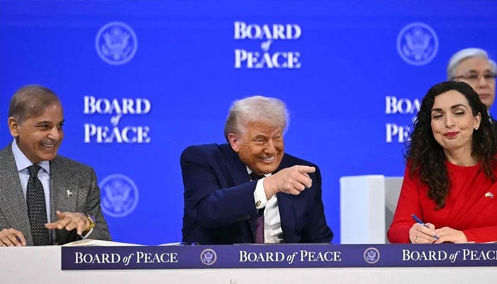 Prime Minister Shehbaz Sharif (left) and Kosovo’s President Vjosa Osmani speak with US President Donald Trump at the “Board of Peace” meeting in Davos on January 22, 2026. — AFP