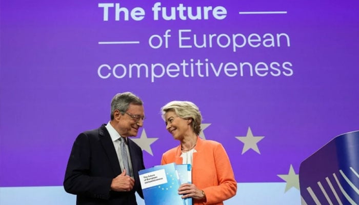 Former Italian prime minister and economist Mario Draghi (left) and European Commission President Ursula von der Leyen pose with documents during a joint press conference about the future of European competitiveness at the EU headquarters in Brussels on September 9, 2024. — AFP