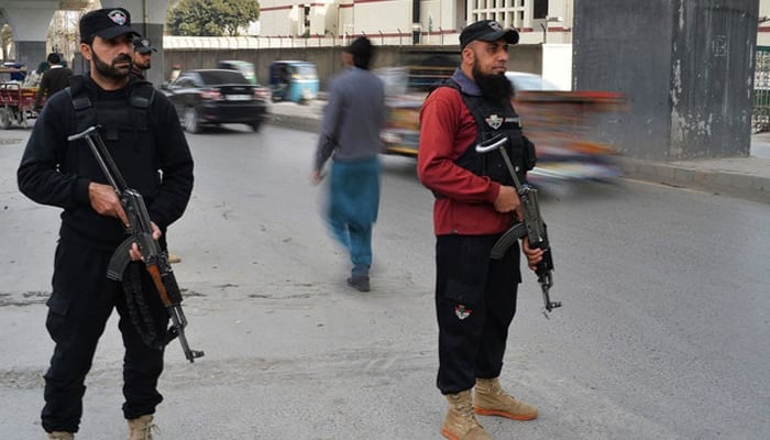 Police personnel stand guard in KP. — AFP/File