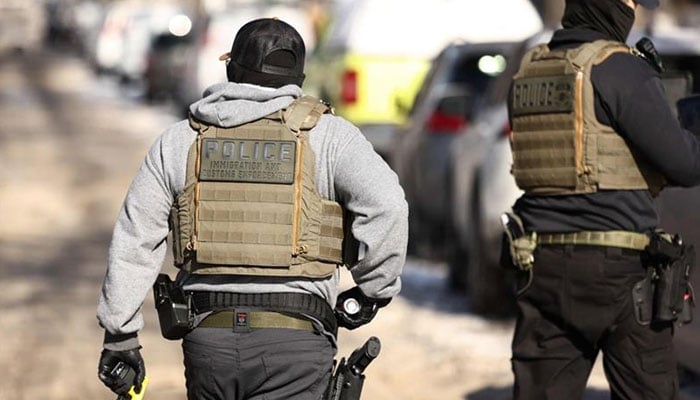 Federal agents are seen during an anti-immigration raid in Minneapolis, Minnesota. —  AFP/File