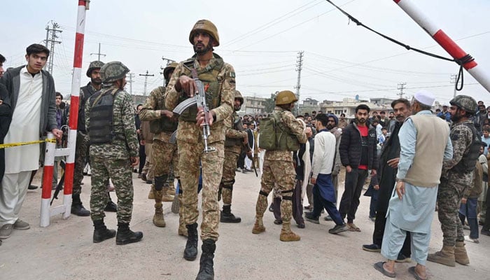 Security personnel stand guard outside a mosque following an explosion in Islamabad on February 6, 2026. — APP
