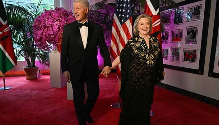 Bill Clinton, 42nd US President and his wife Hillary Rodham Clinton, 67th US Secretary of State, arrive at the Booksellers Room of the White House on the occasion of the State Dinner with the Kenyan president at the White House in Washington, DC, on May 23, 2024. — AFP