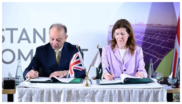 Climate change minister Dr Musadik Malik (left) and UK Minister for International Development Jennifer Chapman sign the UK-Pakistan Green Compact agreement on climate change on December 13, 2025. — Facebook@DrMusadikMalik