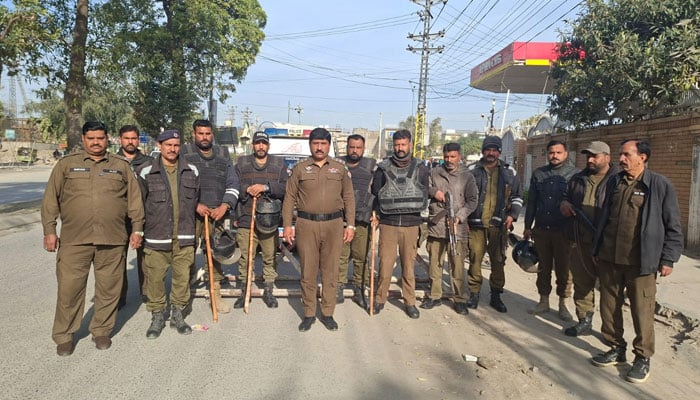 Rawalpindi Police personnel are standing alert on the road in Rawalpindi on February 8, 2026. —Facebook@Rawalpindicpoofficeoffical
