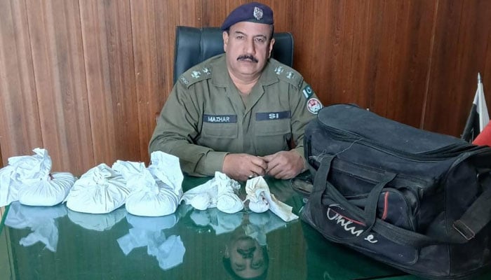 A police official is pictured with the recovered drugs on February 8, 2026. — Facebook@Rawalpindicpoofficeoffical