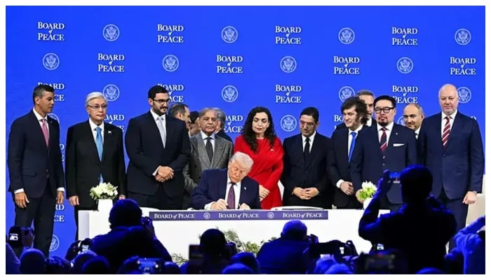Prime Minister Shehbaz Sharif and others pose with US President Donald Trump signing the founding charter at the “Board of Peace” meeting during the World Economic Forum annual meeting in Davos, Switzerland on January 22,2026. — AFP