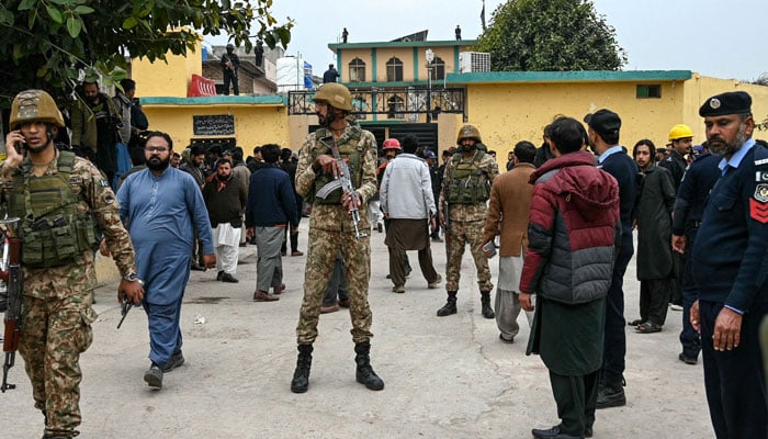 Security personnel stand guard outside a mosque following an explosion in Islamabad on February 6, 2026. — AFP