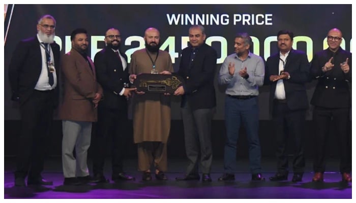 PCB Chairman Mohsin Naqvi (centre) and Walee Technologies representatives at the auction for Multan Sultans at the Expo Centre in Lahore on February 9, 2026. — PCB