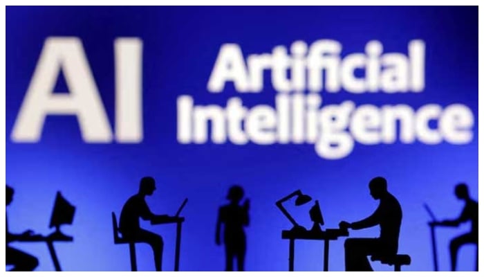 Figurines with computers and smartphones are seen in front of the words Artificial Intelligence AI in this illustration taken, February 19, 2024. — Reuters