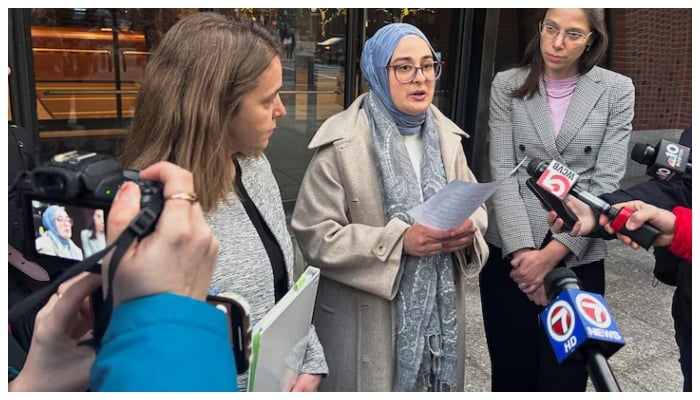 Rumeysa Ozturk, a Tufts University student from Turkey, speaks to reporters after urging a federal judge to order the Trump administration to restore her student visa record, outside the federal court in Boston, Massachusetts, US, December 4, 2025.—Reuters